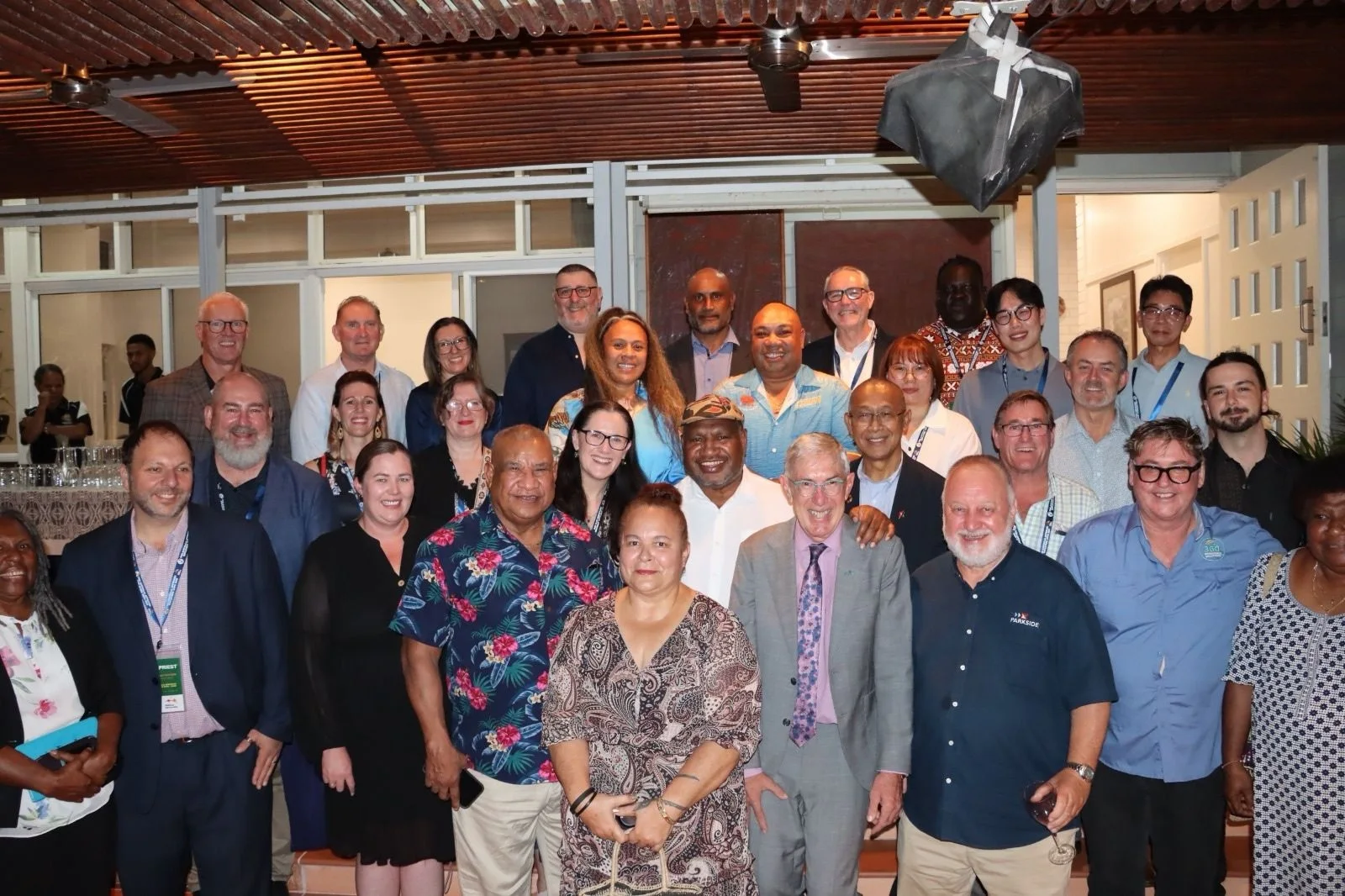 With Papua New Guinea's Minister, the Labour Mobility Unit and fellow approved employers at the PNG–Australia Approved Employer Expo, Port Moresby — government-backed recruitment under the PALM scheme.